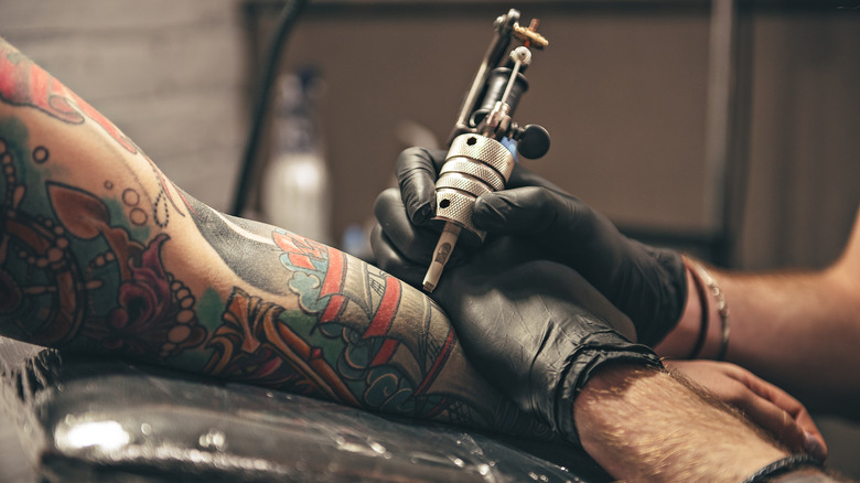 arm getting tattooed