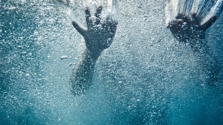 Hands under water