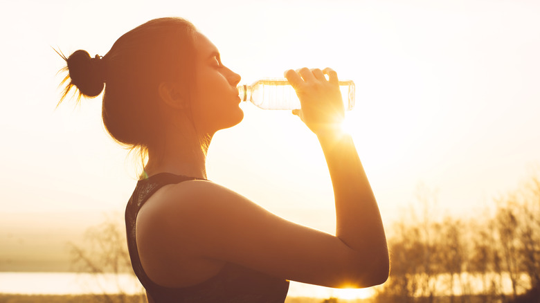 Drinking water from a bottle