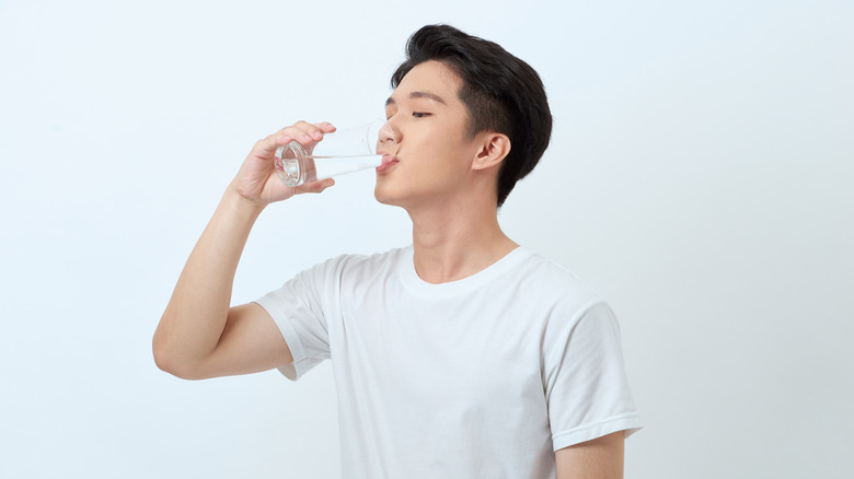 Drinking water from a glass