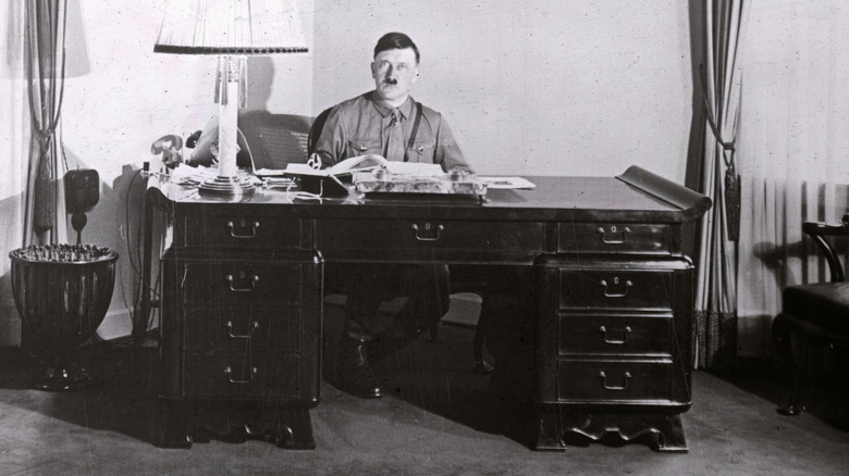 Hitler sitting at desk