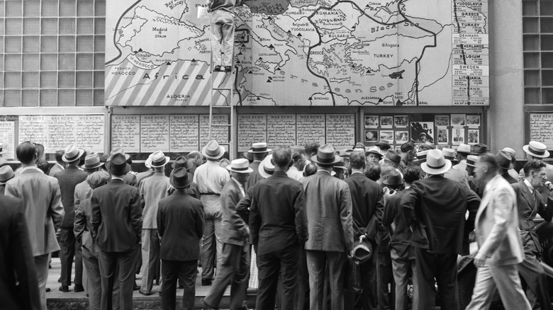 Crowd reading war map in front of Philadelphia Map Building, Philadelphia, 1940