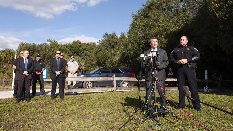 Federal and local agents stand together during a news conference