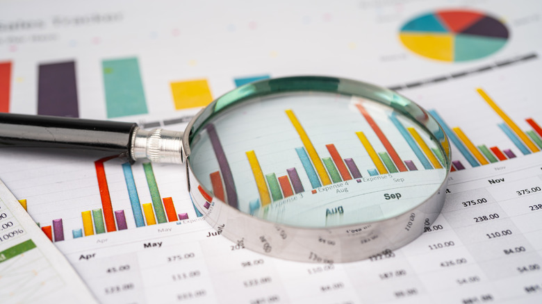 magnifying glass on top of a data sheet