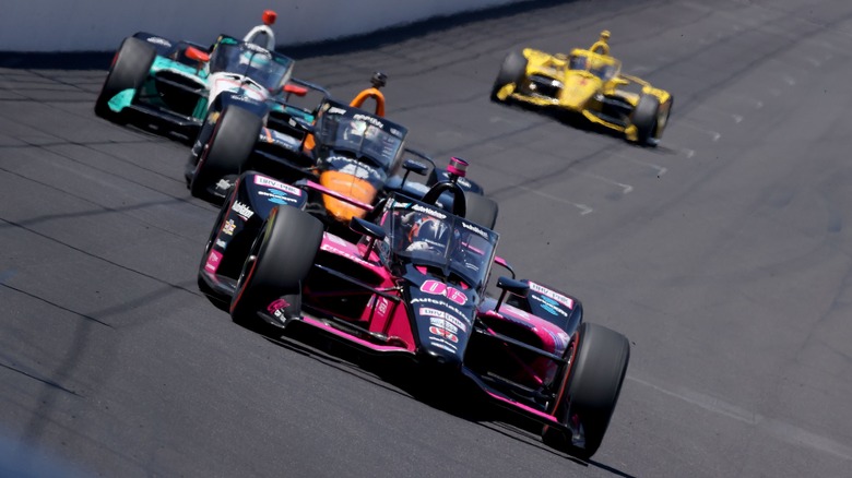 Hélio Castroneves and racecar drivers at Indy 500