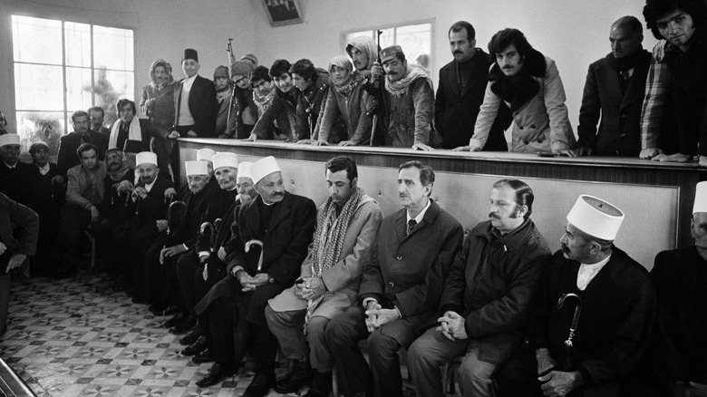 Druze elders meeting sitting on benches