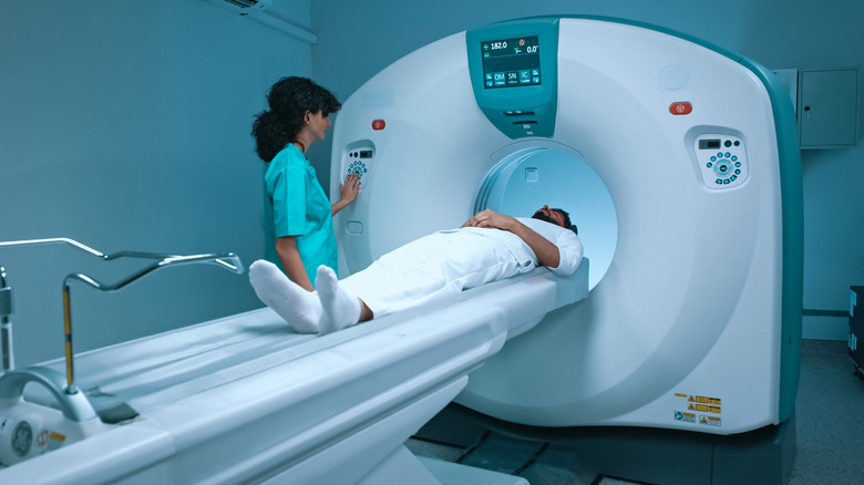 Operator and patient with MRI machine