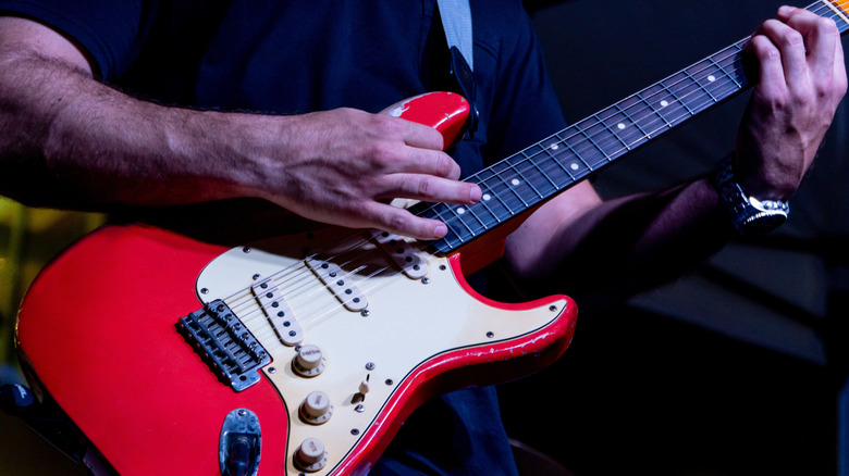 Guy playing Stratocaster