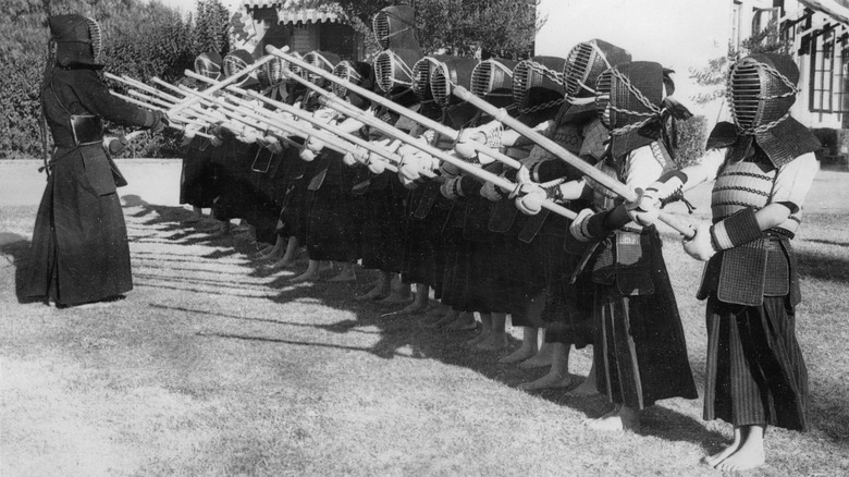Kendo practitioners holding sticks