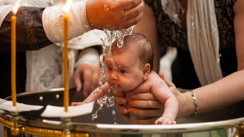 an infant is baptized