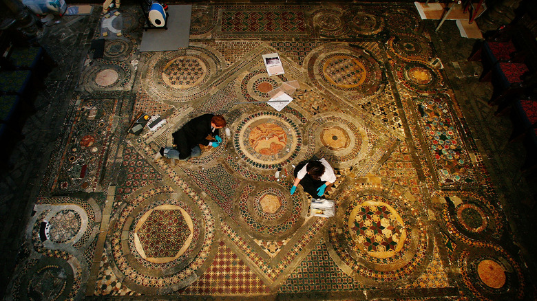 Conservators restoring the Cosmati Pavement