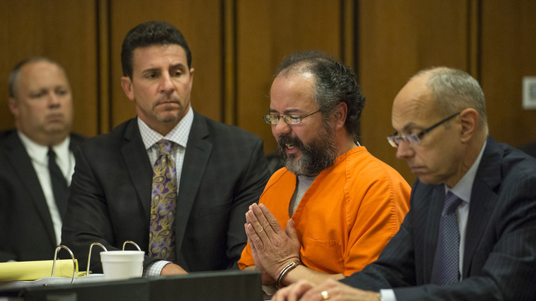 Man praying in court