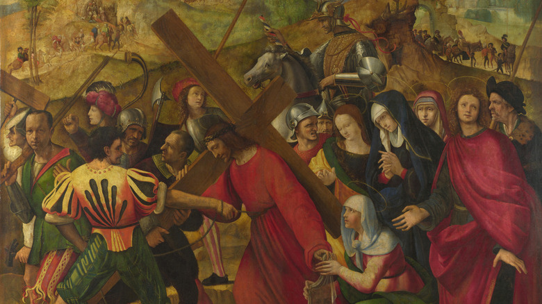 Jesus red robe carrying cross crowd