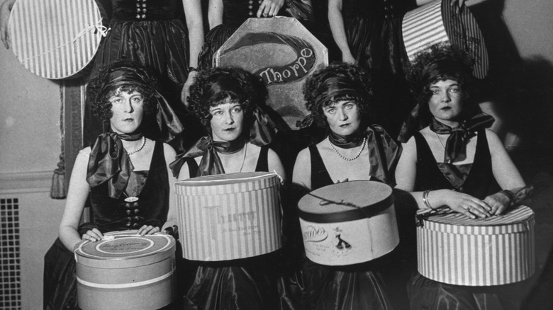 1920s high society debutantes at a benefit event