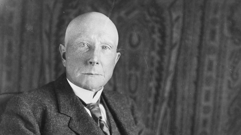John D. Rockefeller seated for a photo