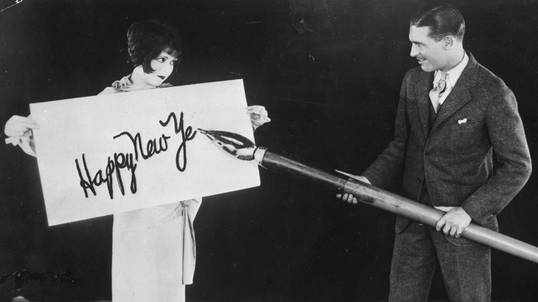 Clara Bow Larry Gray New Year's greeting with a giant pen