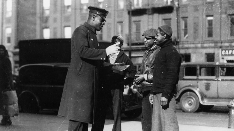Harlem police officer with three children 1930s