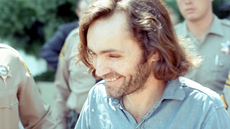 young Charles Manson outside