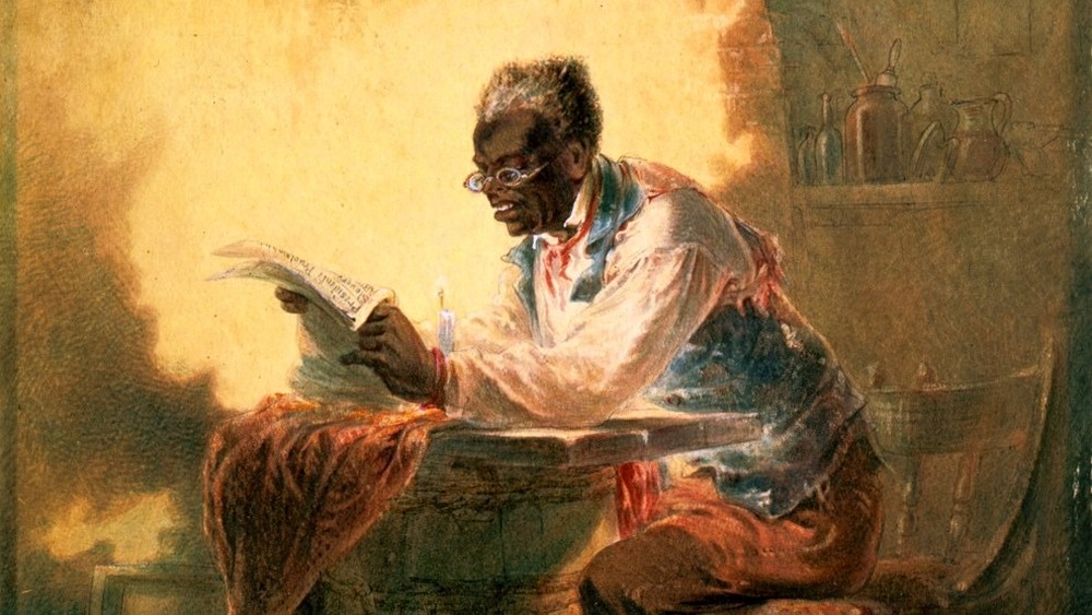 man reading newspaper article about Emancipation Proclamation