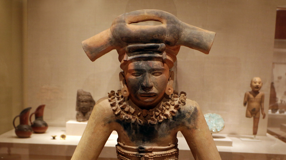 Pre-Columbian art statue in tan stone