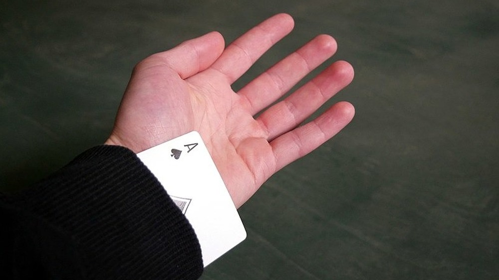 Card cheat with ace up sleeve