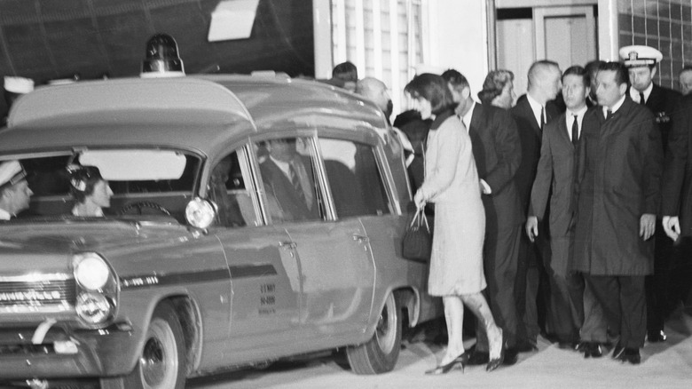 Jackie Kennedy by the ambulance with JFK's body