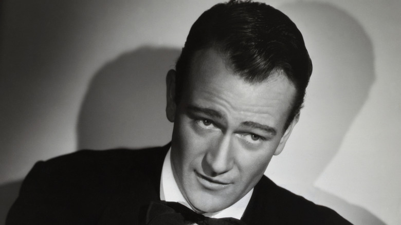 Young John Wayne suit posing