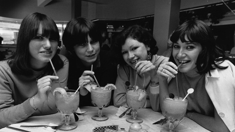 Teenagers enjoying cocktails in 1980
