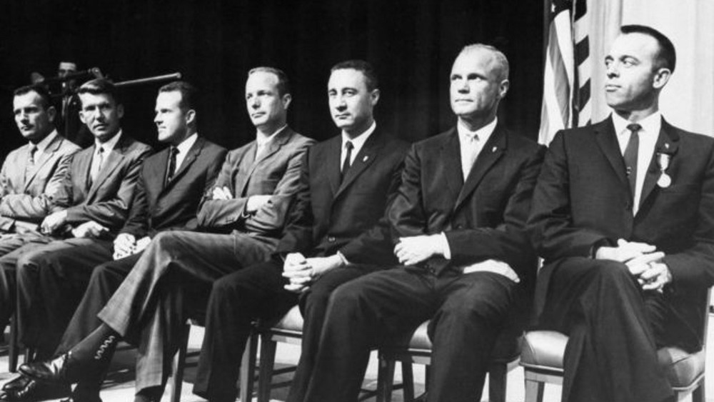 Mercury Seven sitting in a row