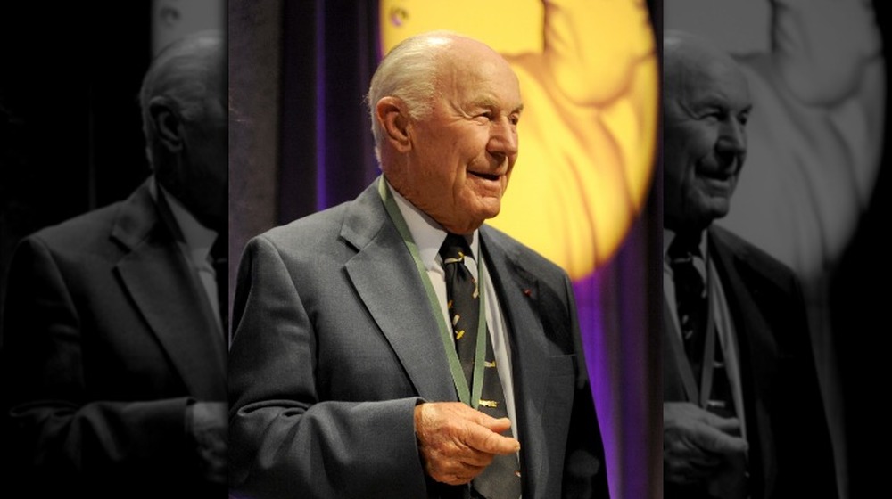 Chuck Yeager standing wearing medal 