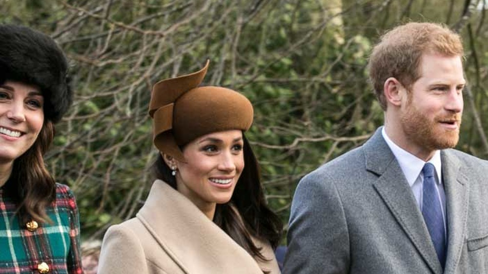 Cropped photo by Mark Jones of the Duchess of Cambridge, Meghan Markle and Harry, https://creativecommons.org/licenses/by/2.0/