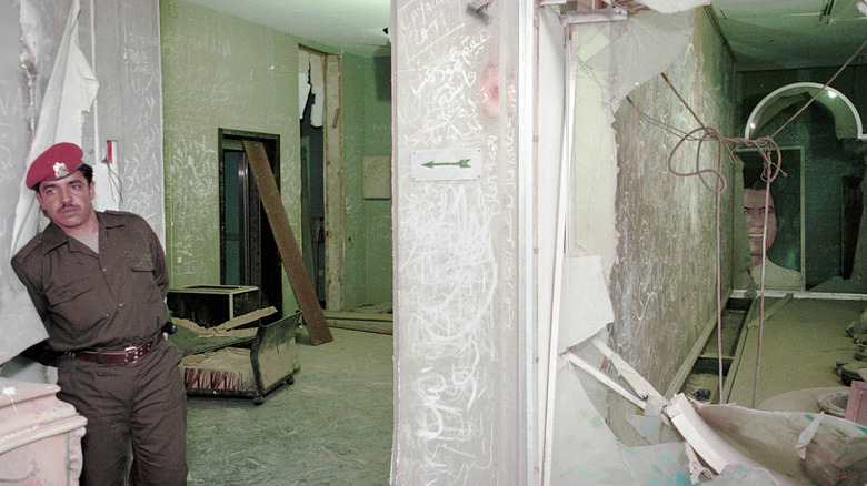 A Libyan soldier stands inside leader Muammar Qaddafi's compound February 1, 2001 in Tripoli