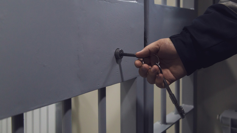 Jail cell gate being unlocked