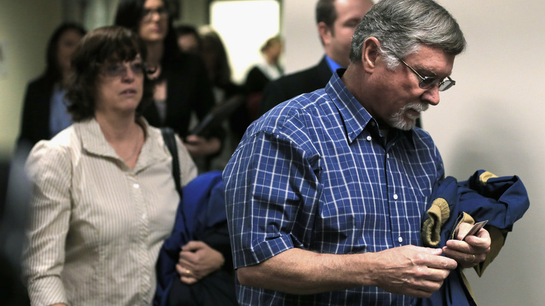 Robert and Arlene Holmes walking into court