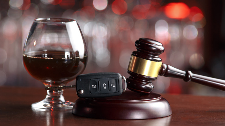 Wine glass next to gavel