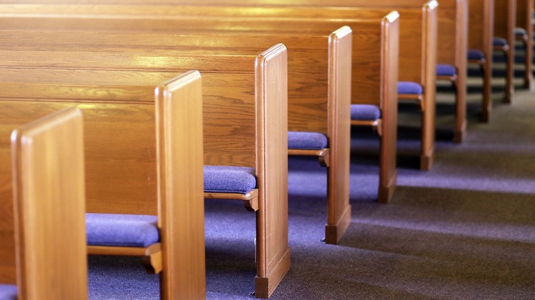 empty rows of church pews