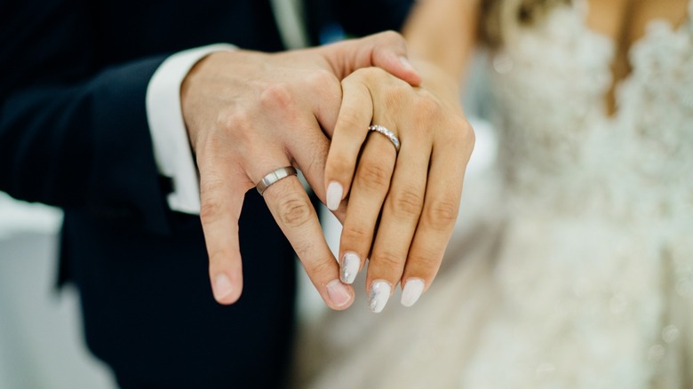 Hands with wedding rings