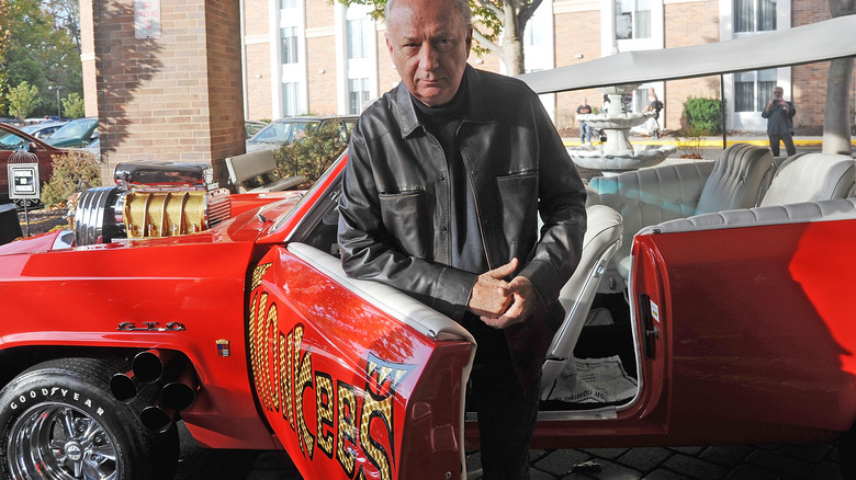 Mike Nesmith getting out of a car
