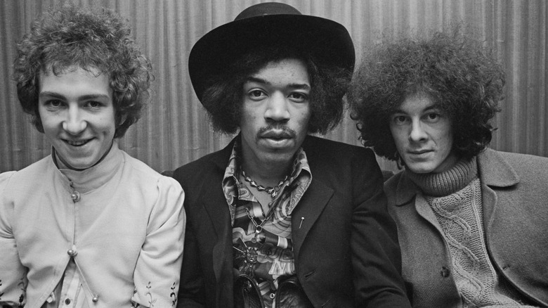 Mitch Mitchell with Jimi Hendrix posing camera