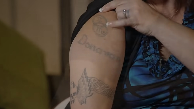 Tracy Brown shows her arm tattoos