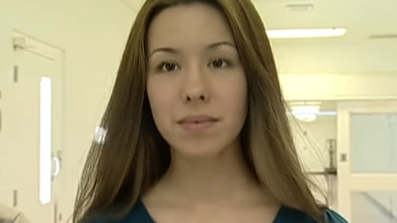 Jodi Arias walking down hallway looking ahead