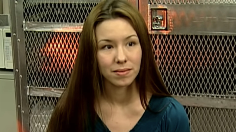 Jodi Arias listening in interview jail door background