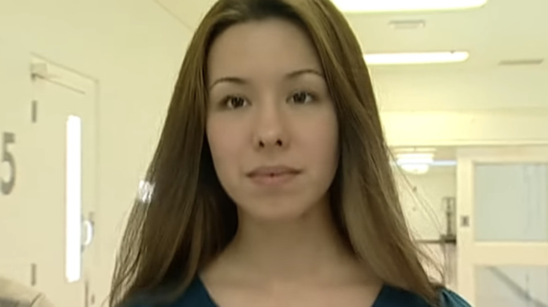 Jodi Arias walking down hallway looking ahead
