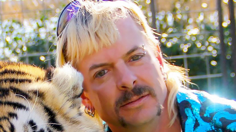 Joe Exotic cuddling tiger