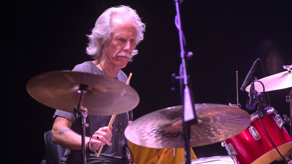 John Densmore playing drums