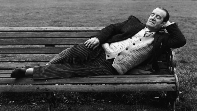 Alfred Lennon lounging on bench