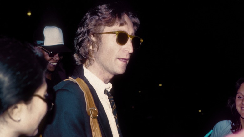 John Lennon walking in glasses