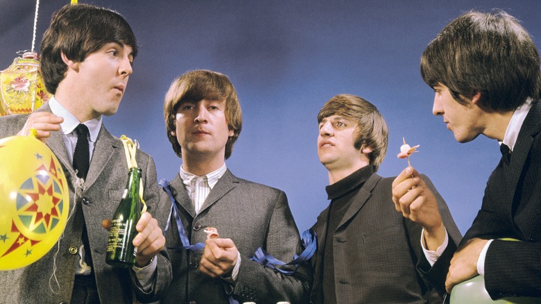 The Beatles eating canapes