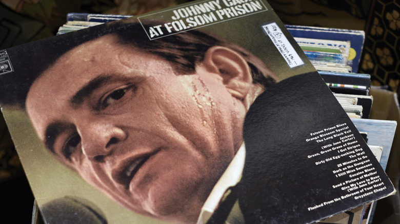 Johnny Cash's At Folsom Prison record on stack of other LPs