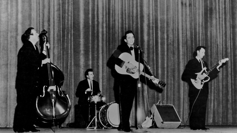 Johnny Cash and his band playing on small stage